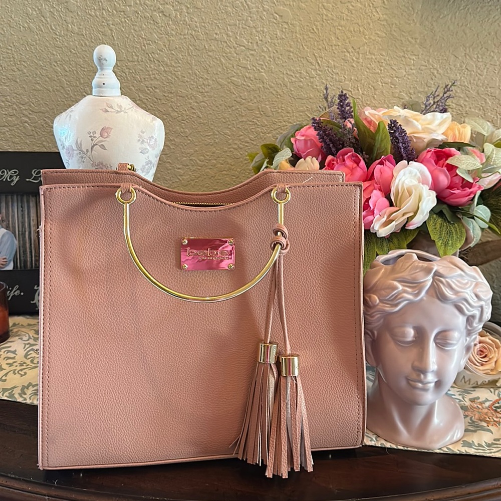 Bebe gorgeous Rose bag with gold accents and tassels strap is included!